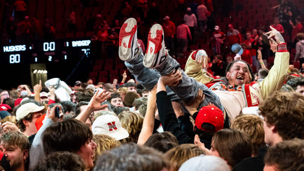 Feb 1, 2024; Lincoln, Nebraska, USA; Nebraska Cornhuskers fans celebrate after the Huskers defeated the Wisconsin Badgers at Pinnacle Bank Arena.